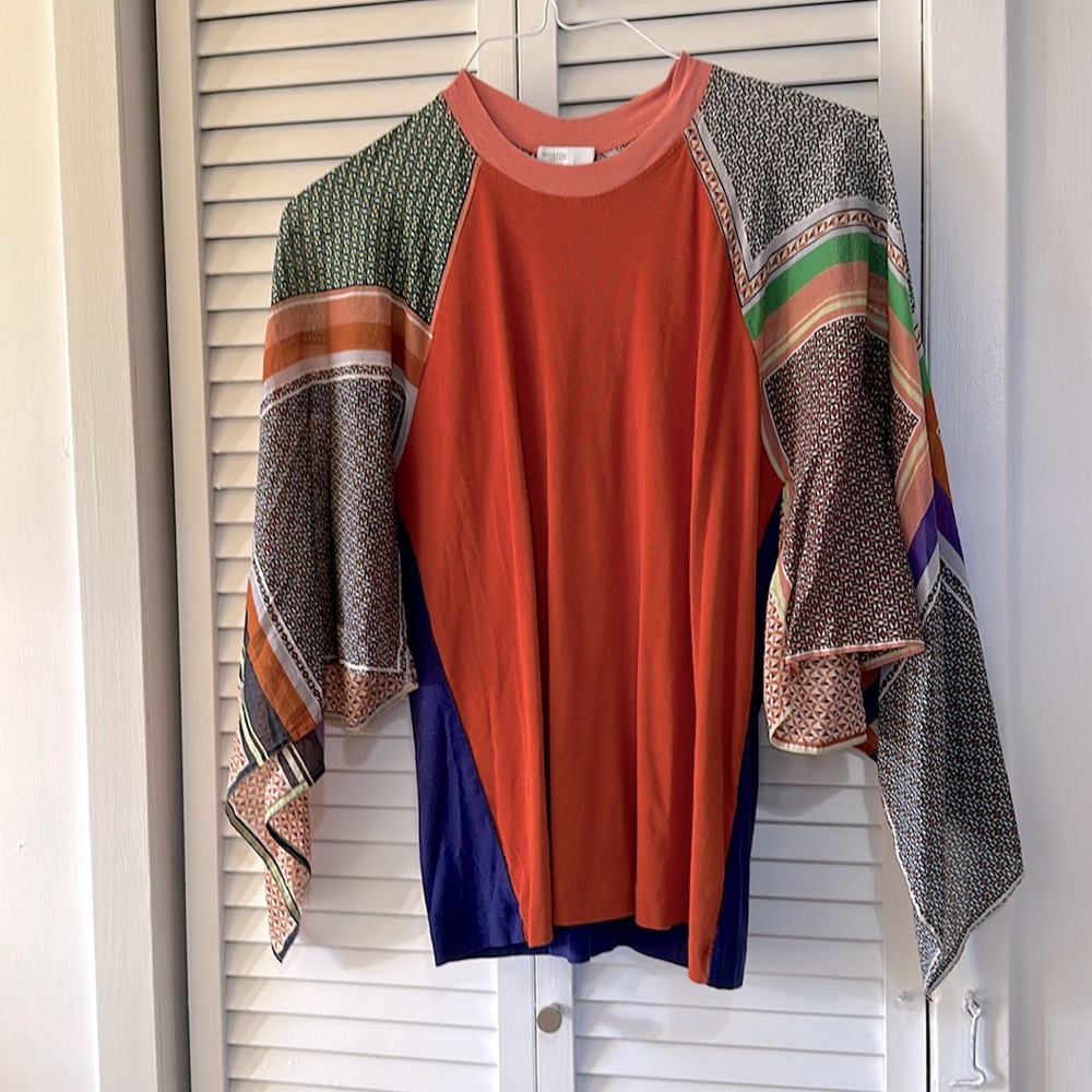 Crewneck  w/handkerchief sleeves. Orange chest & eggplant back Rosetta Getty